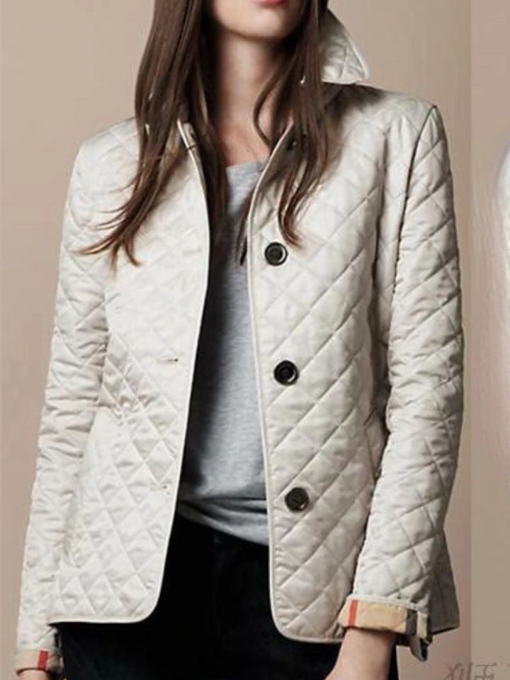 Versatile women's quilted jacket, a must-have for fall & winter fashion. Features an elegant turned-down collar.