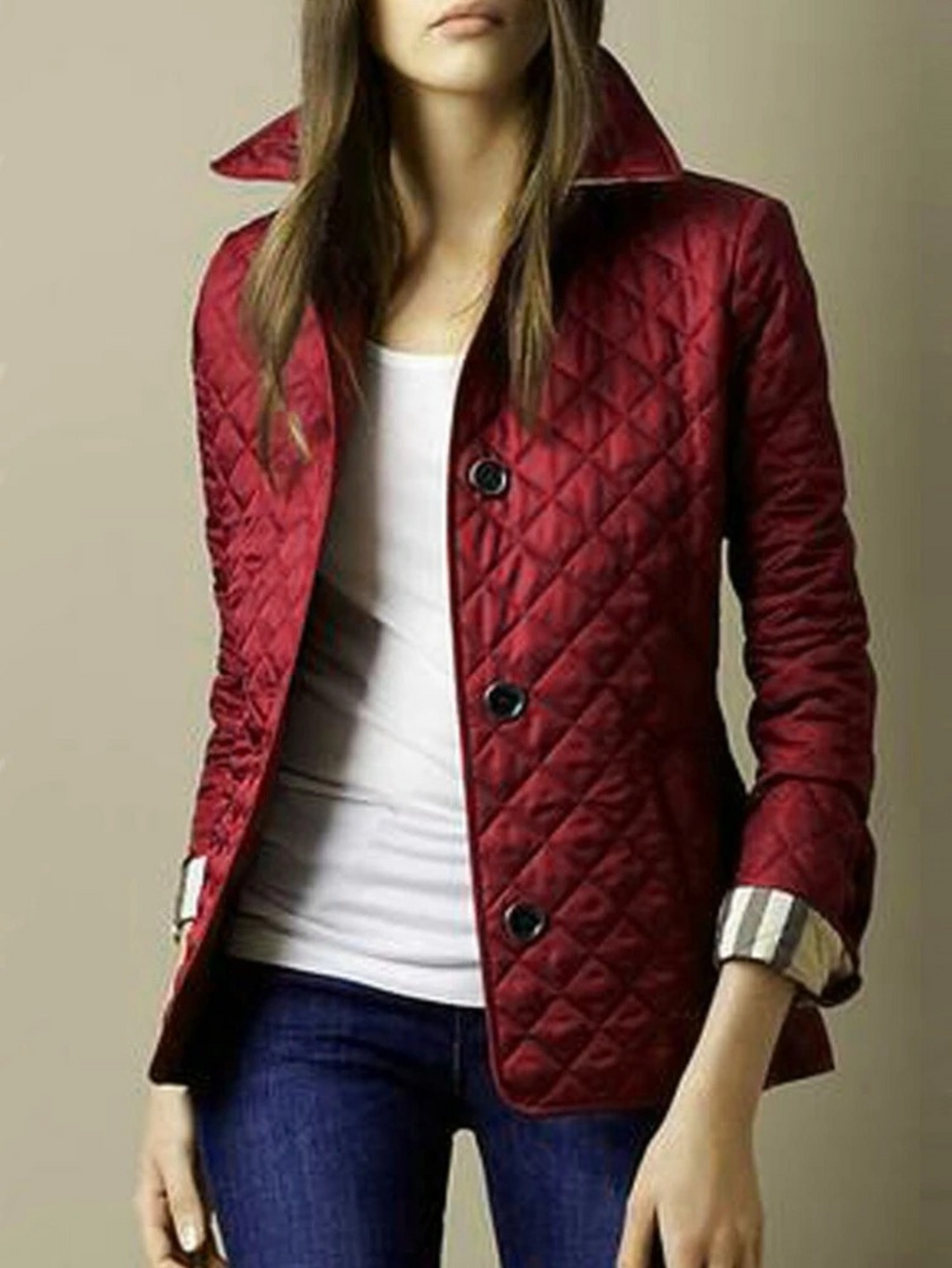 Chic women's quilted jacket with elegant turned-down collar. A versatile snap-button outerwear piece for women's fashion.