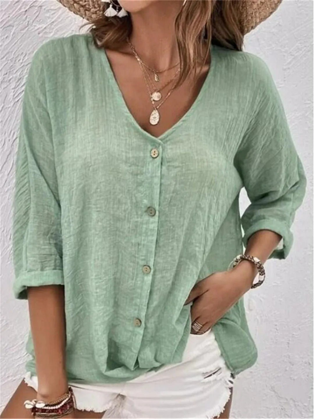 Women's casual V-neck button-front top in relaxed fit for comfortable everyday style.