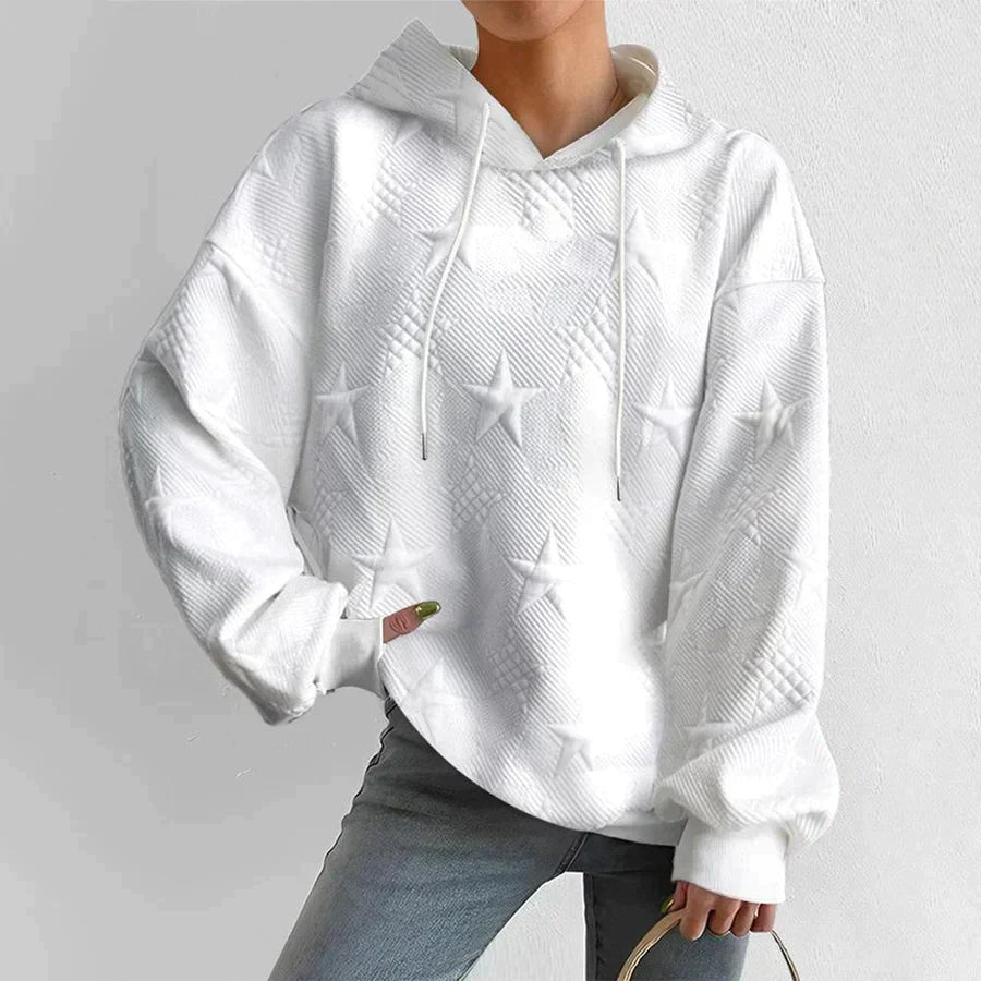 Women's casual white hoodie with subtle embossed star print, perfect for cozy loungewear.