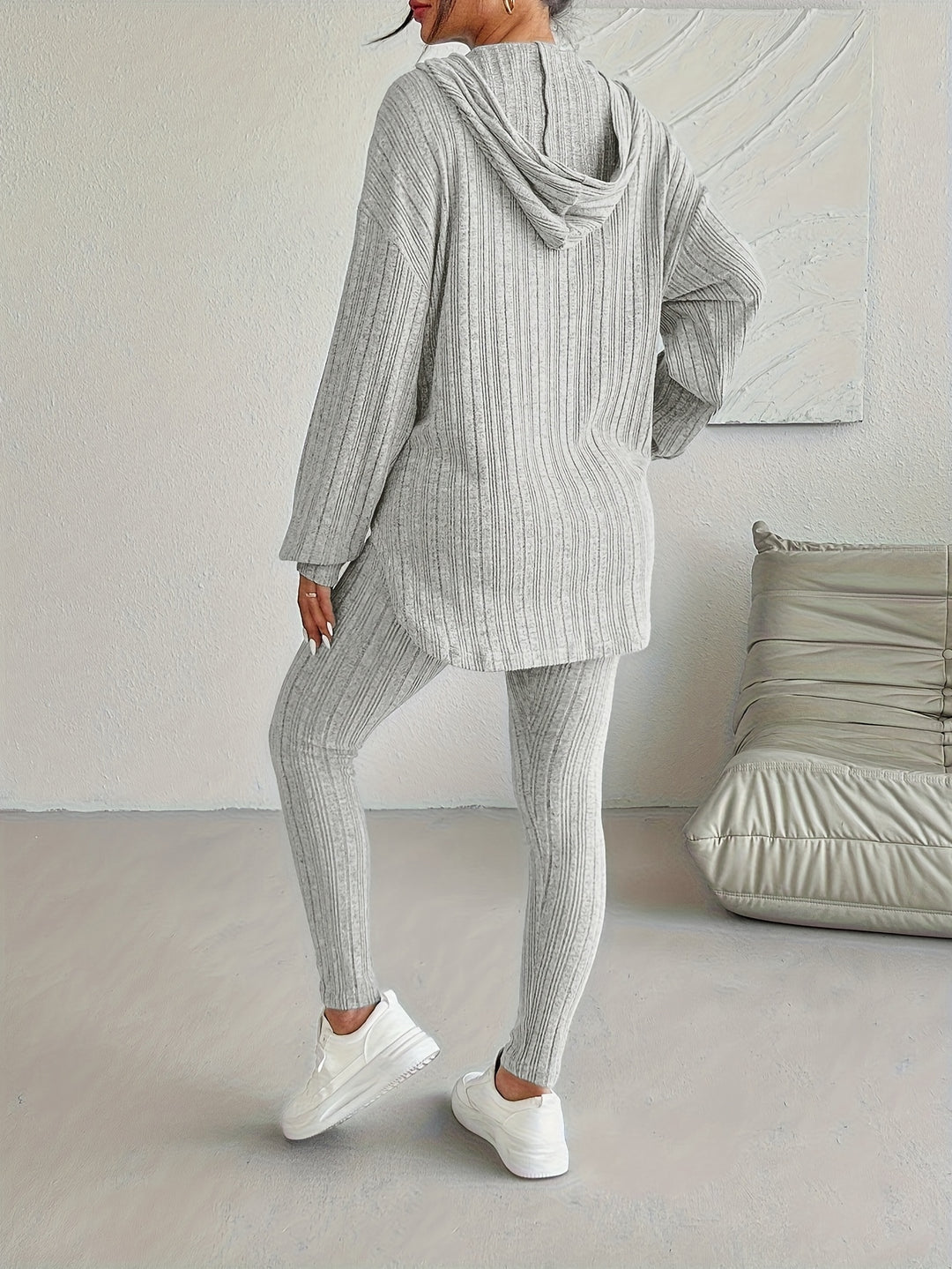 Full length image of a woman in a comfortable ribbed knit loungewear set, perfect for activewear