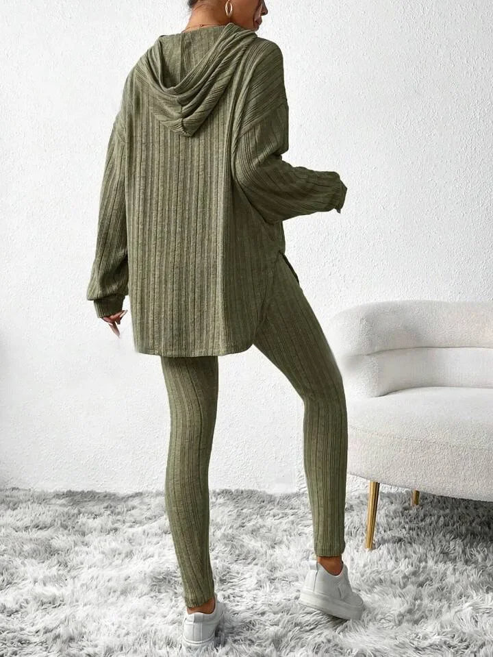 Detailed shot of the ribbed knit hoodie's drawstring and cowl neck, part of a loungewear set
