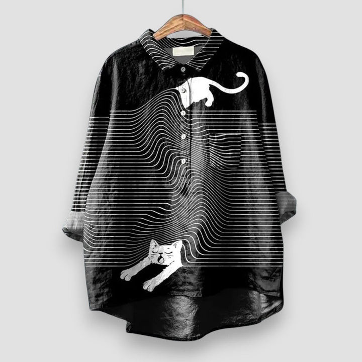 Stylish women's animal print blouse with playful dog design. Long sleeve, button-front top for versatile fashion.