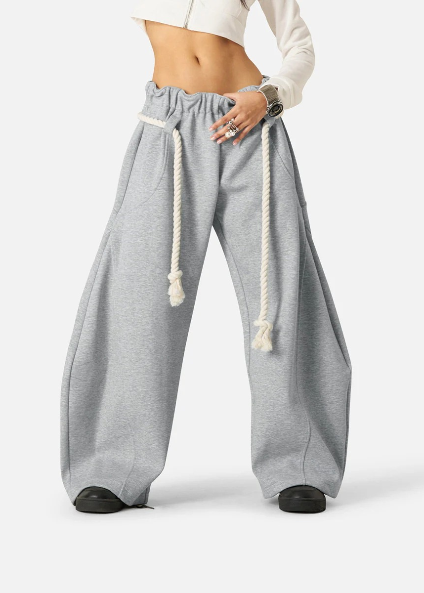 Modern women's fashion pants: high-waisted barrel leg sweatpants with an adjustable drawstring for a chic look.