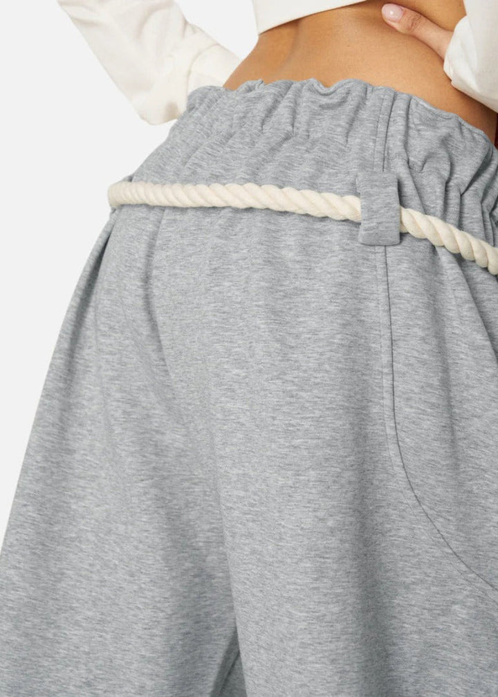 Chic women's lounge sweatpants with a modern barrel leg and high-waisted adjustable design for ultimate comfort.