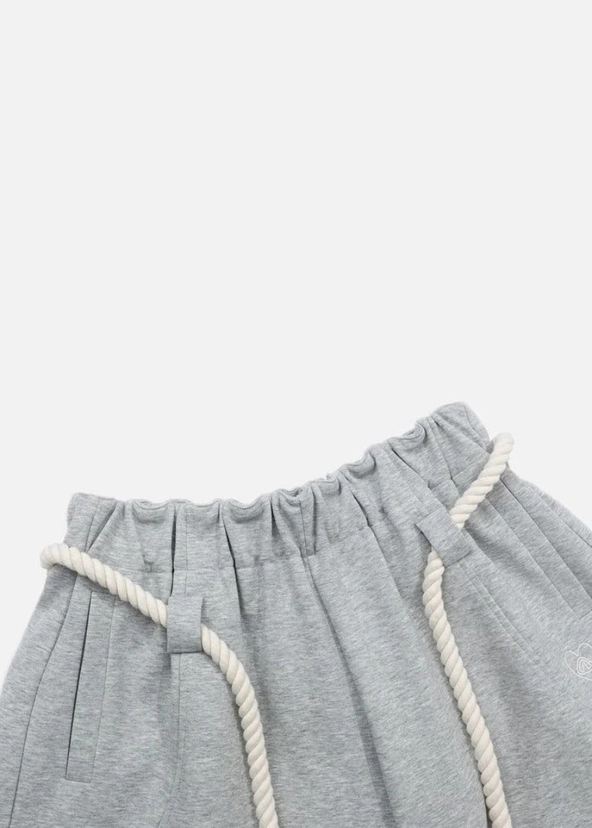 Fashionable women's barrel leg comfort pants, wide-legged and high-waisted, ideal for a contemporary casual outfit.