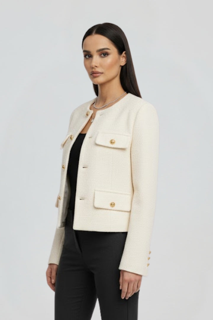 Women's cropped button-front jacket in a chic style, featuring practical pockets for modern fashion.
