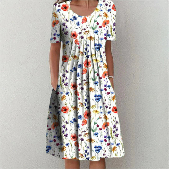 Women's chic floral midi dress with short sleeves & round neck. Perfect for casual summer style.