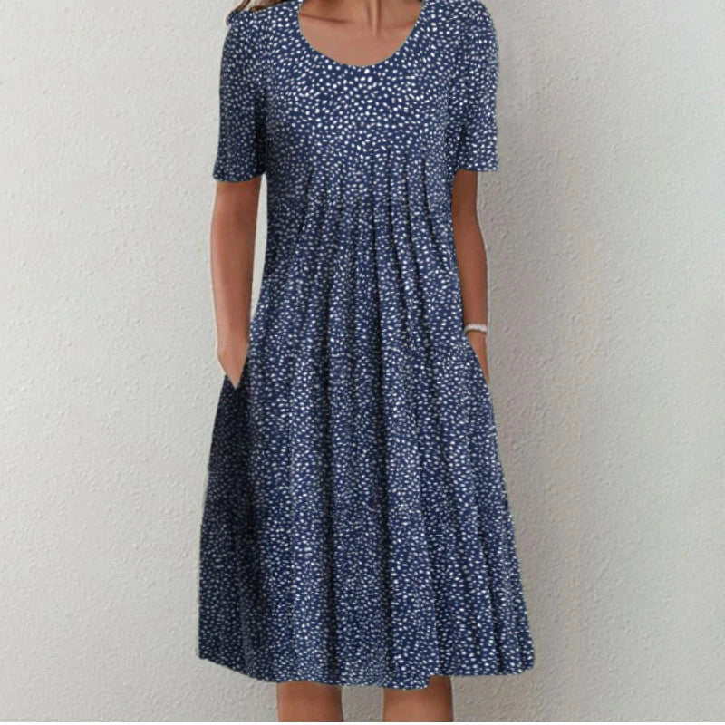 Comfortable floral midi dress for women. Stylish short sleeve design with convenient pockets.