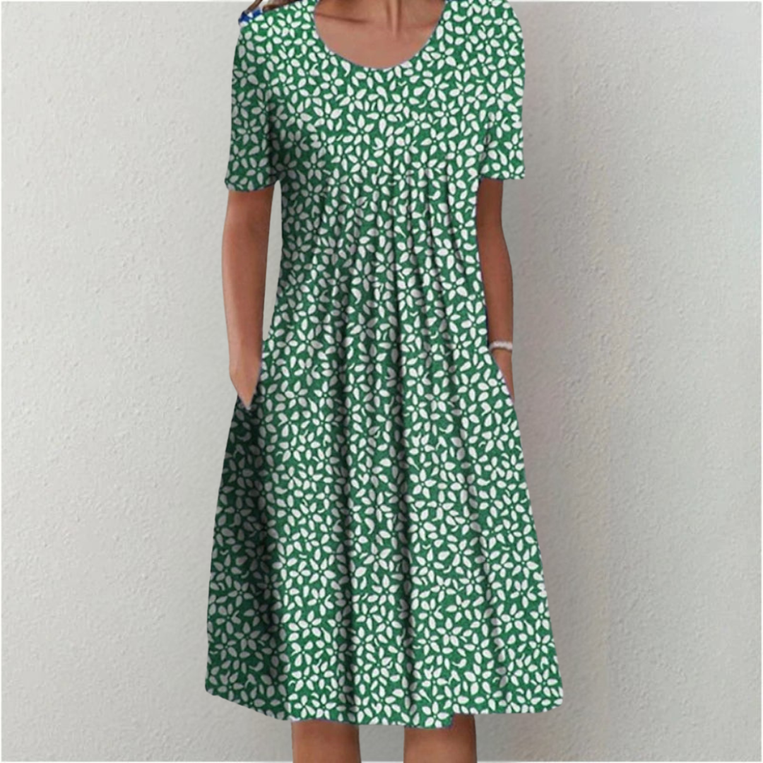 Vibrant floral print midi dress for women. Comfortable short sleeve design, perfect for a chic look.