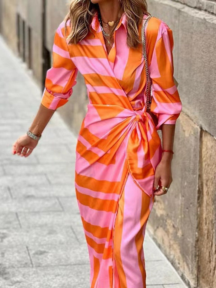 Flattering women's printed wrap dress with a midi length, designed for a chic & elegant look.