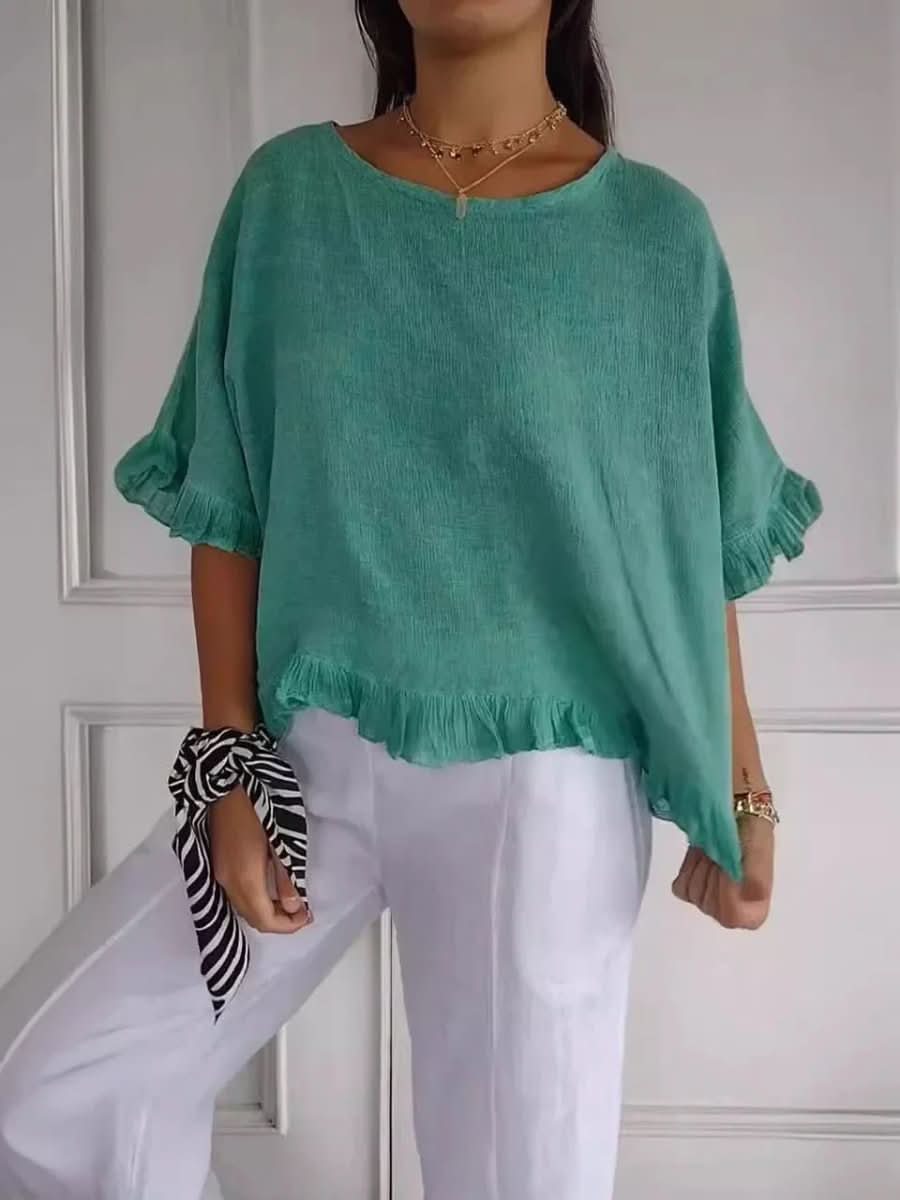 Versatile women's ruffle top, suitable for casual wear or elevated for an elegant look.
