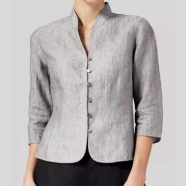 Dressy women's stand-collar blouse for workwear or casual chic everyday fashion. Button-front detail.