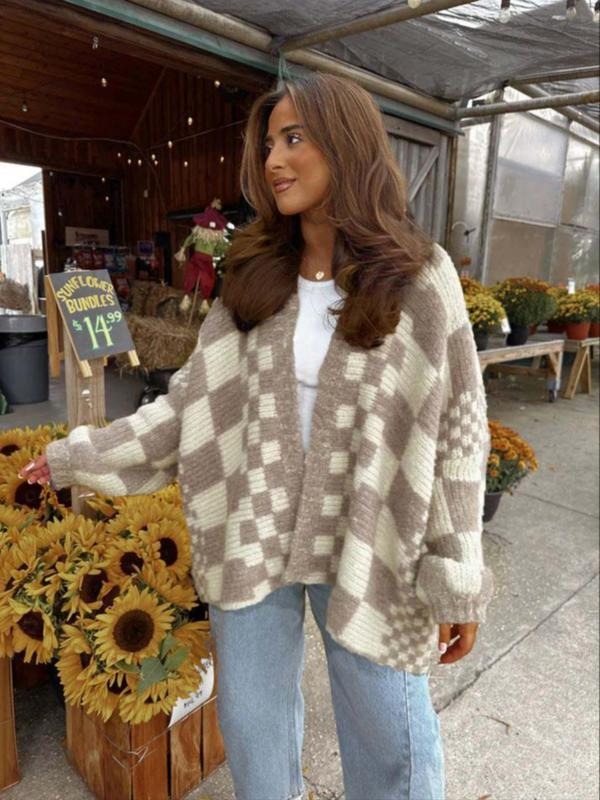 Model wearing a women's oversized chunky knit check draped cardigan, perfect for winter layering
