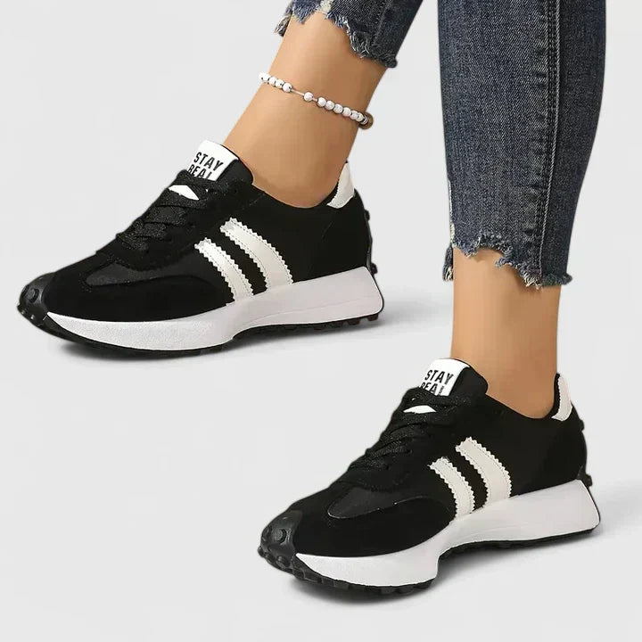 Women's chunky running shoes for gym workouts. Comfortable athletic sneakers with a sporty lace-up design.