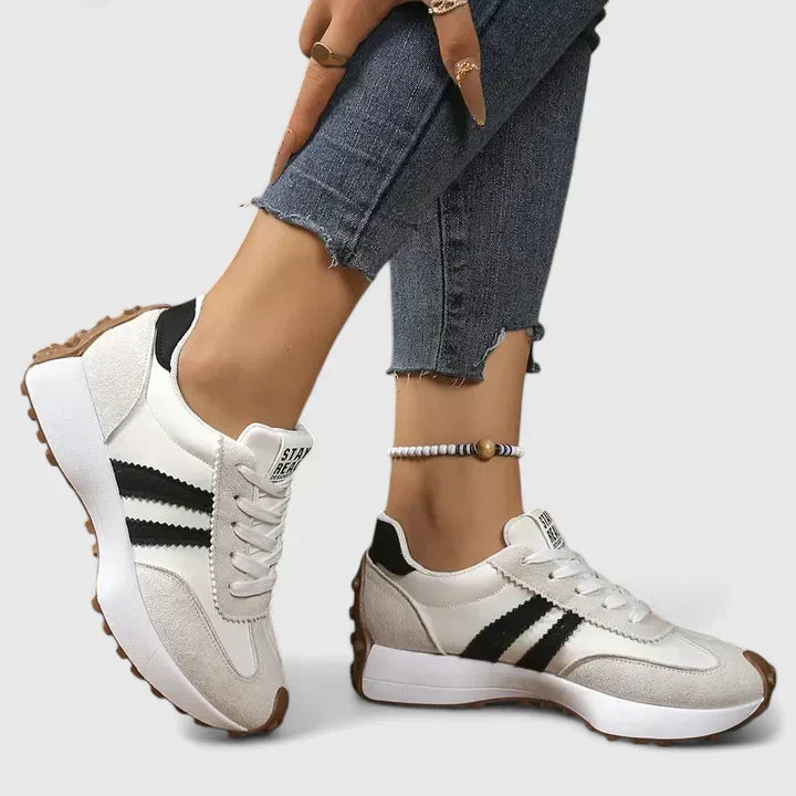 Sporty women's chunky sole athletic shoes, perfect for running, gym, and active wear. Durable lace-up trainers.