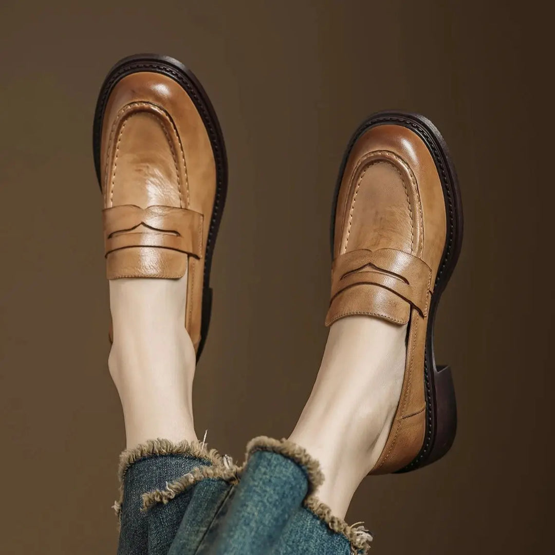 Women's classic light brown leather T-strap dress shoes, elegant and comfortable flats for versatile wear.