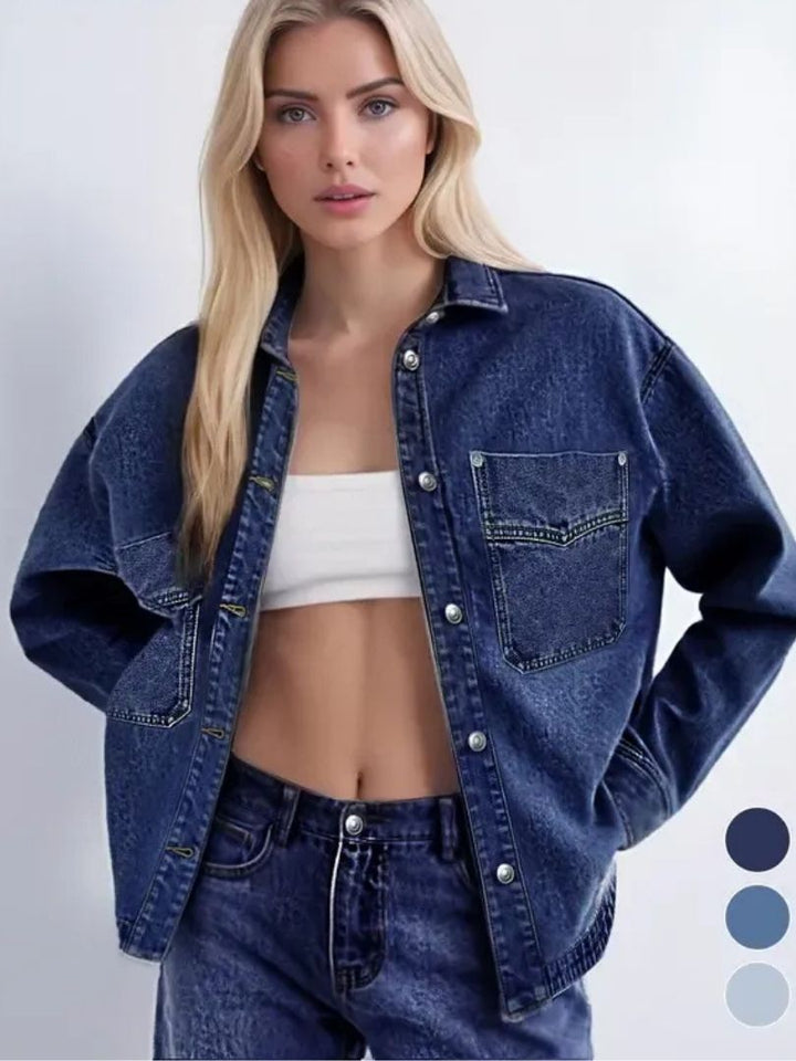 Close-up of a women's blue denim jacket, showcasing the classic fabric and casual style.