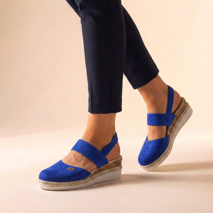 Women's comfortable platform espadrille sandals with a trendy wedge heel, perfect for summer & beach style.