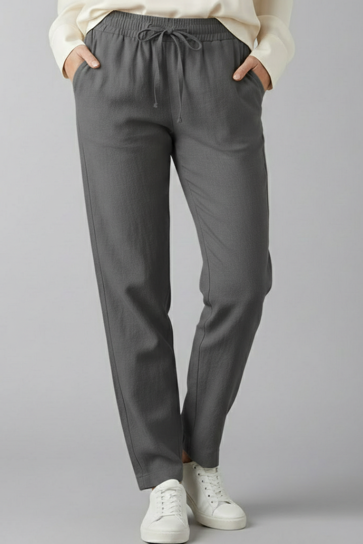 Women's everyday wear trousers with elastic waist, side pockets, & a flattering tapered fit.