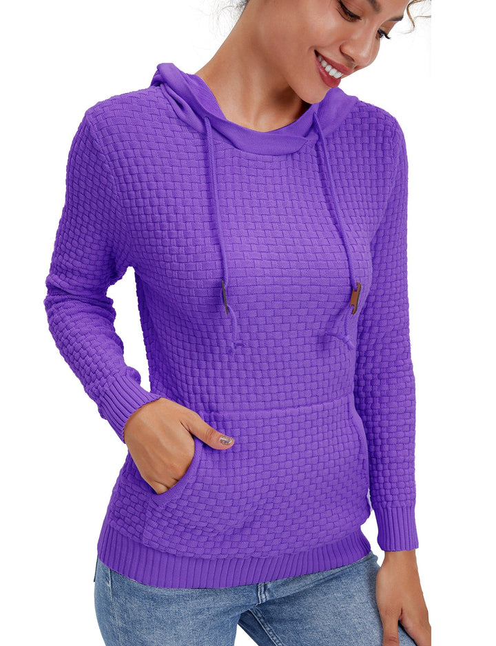 Detail of the ribbed cuffs and hem on a women's breathable pullover hoodie.