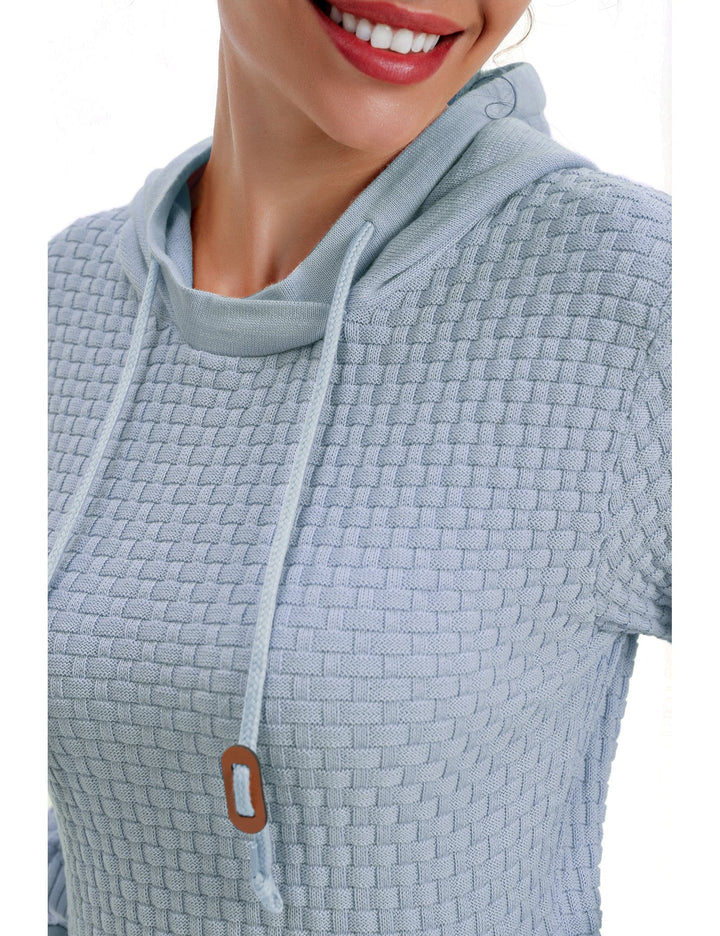 Dynamic shot of a woman moving while wearing a breathable hoodie, showing flexibility.