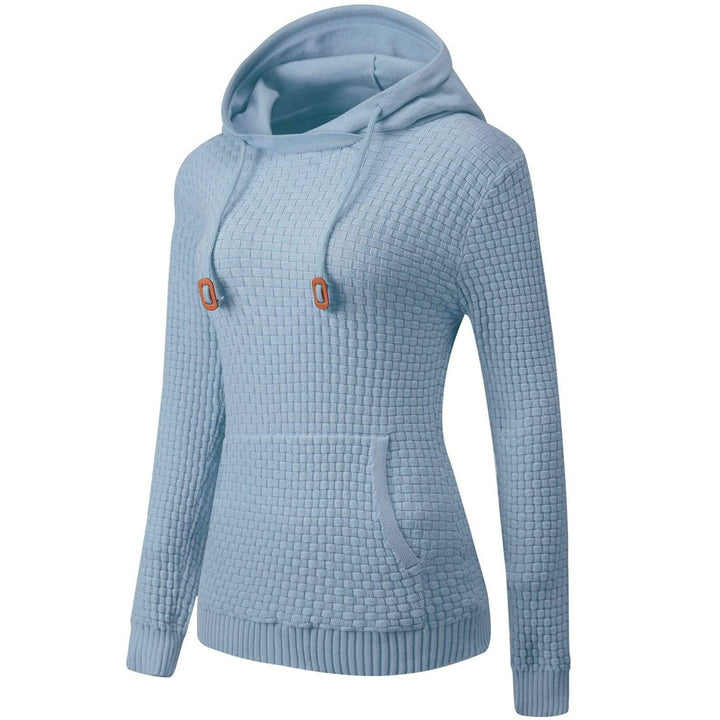 Side profile of a woman wearing a casual light grey hoodie, ideal for comfort and layering.