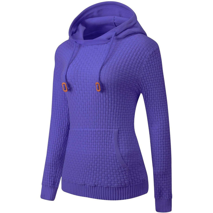 Close-up of the breathable cotton blend fabric of a women's pullover hoodie, soft texture.