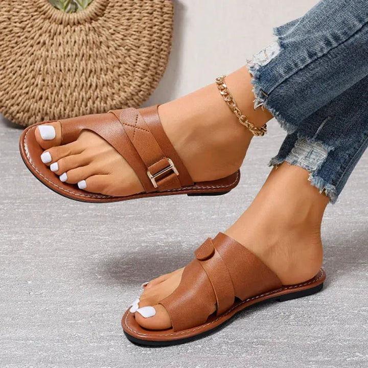 Lightweight women's buckle sandals, great for versatile summer fashion and everyday comfort.