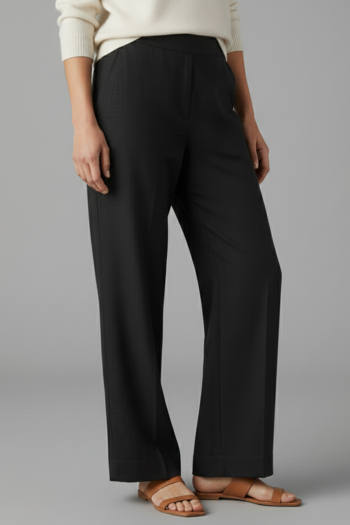 Woman models versatile straight leg pull-on trousers, ideal for office work or casual comfort.
