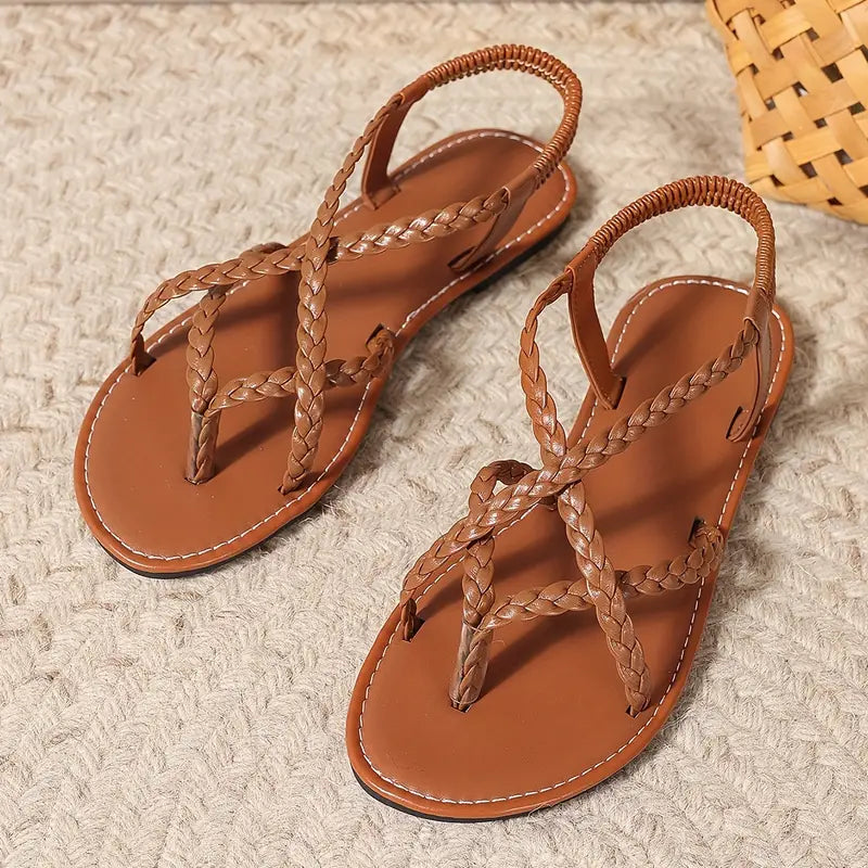 Comfy women's flat sandals with elastic straps and open-toe design, perfect casual summer footwear for women.
