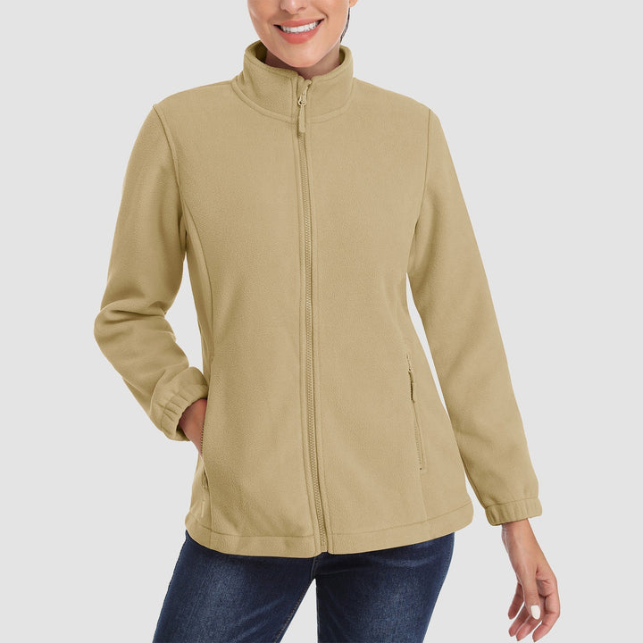 Outdoor scene: woman enjoying a brisk day in a purple full-zip fleece jacket, perfect winter wear