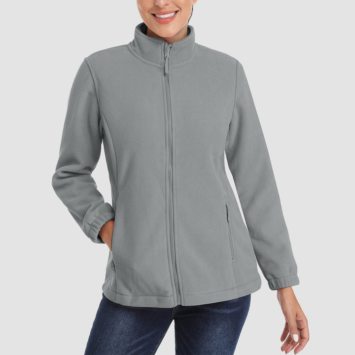 Close-up of the collar and zipper of a women's full-zip fleece jacket, emphasizing warmth