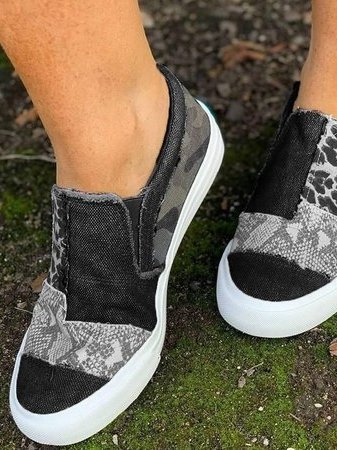 Close-up of leopard print slip-on shoes for women, showcasing detailed animal print and texture