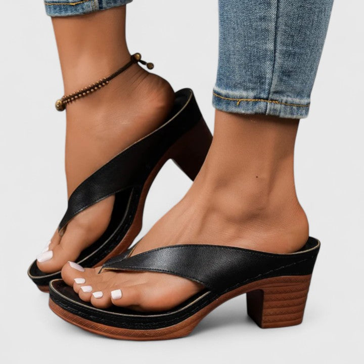Close-up of elegant women's orthopedic heels showing cushioned footbed & durable slip-resistant sole.