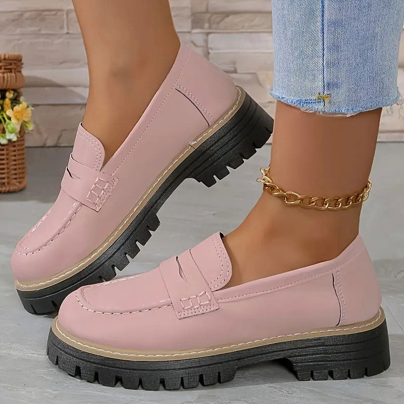Top view of women's comfortable orthopedic loafers, showcasing slip-on design & quality stitching.