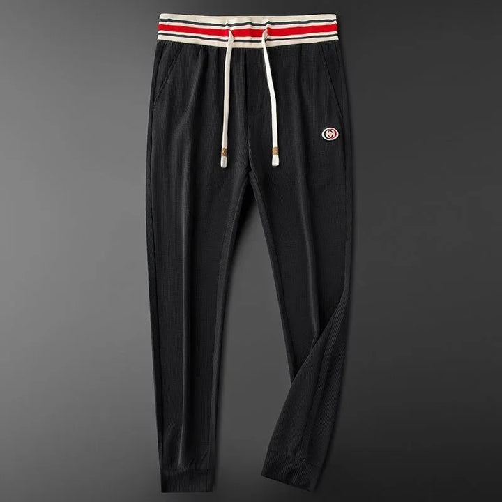 Black women's comfortable ribbed athletic joggers. Ideal for lounge, light activity, or casual everyday wear.