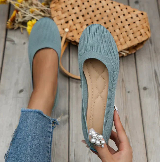 Top view of sleek women's ballet flats, showcasing comfortable slip-on design.