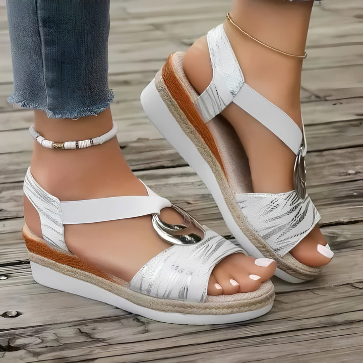 Fashionable women's wedge sandals with arch support, a stylish slip-on design for summer footwear.