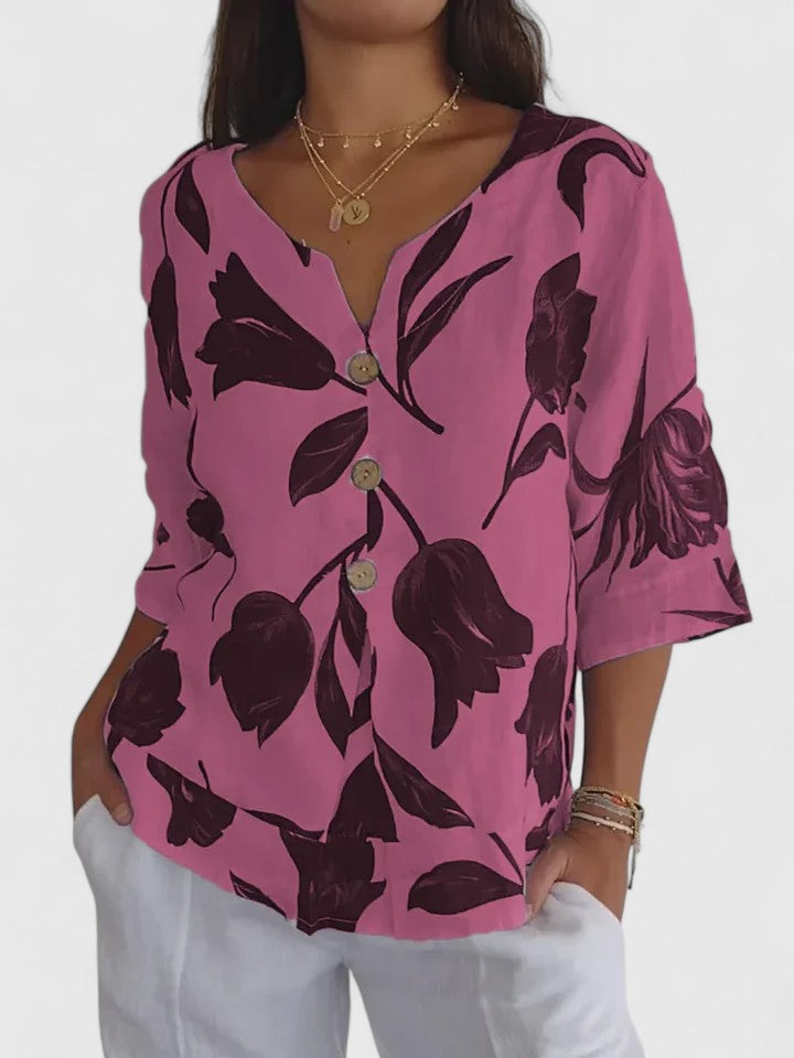 Stylish women's floral V-neck blouse. Comfortable long-sleeve everyday top, ideal for a chic casual look.