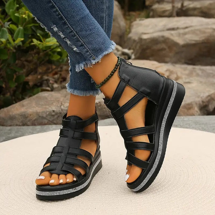 Side profile of comfortable women's wedge sandals, showcasing elevated design & everyday wearability.