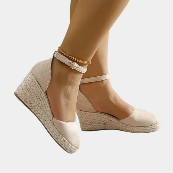 Women's comfortable wedge sandals with adjustable ankle strap, ideal for daily wear.