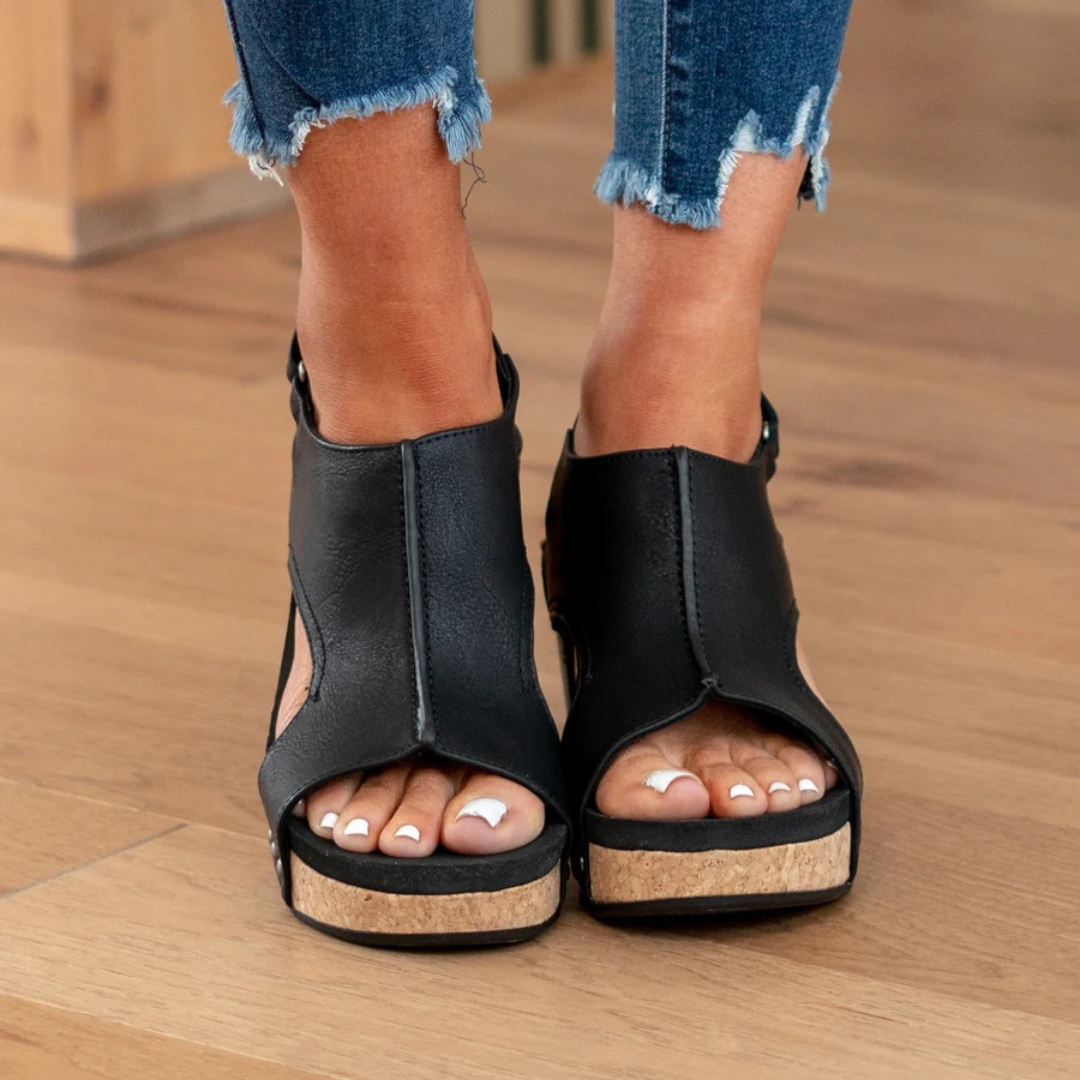 Fashionable women's wedge sandals with elastic straps. Comfortable, elegant summer shoes for versatile everyday wear.