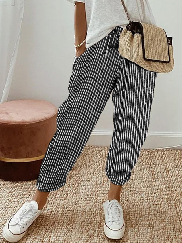 Women's versatile summer lounge pants, relaxed fit with drawstring, ideal for beach, travel, & comfort.