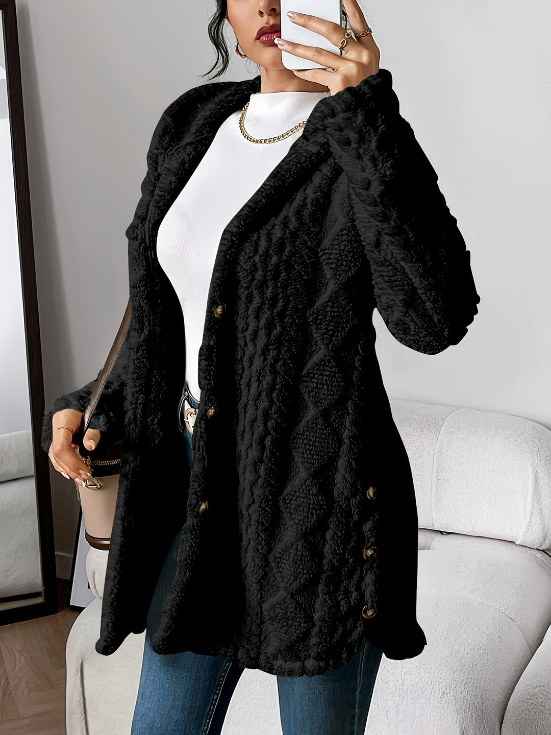 Textured women's hooded long jacket. Button-front design for chic and cozy fall/winter fashion.