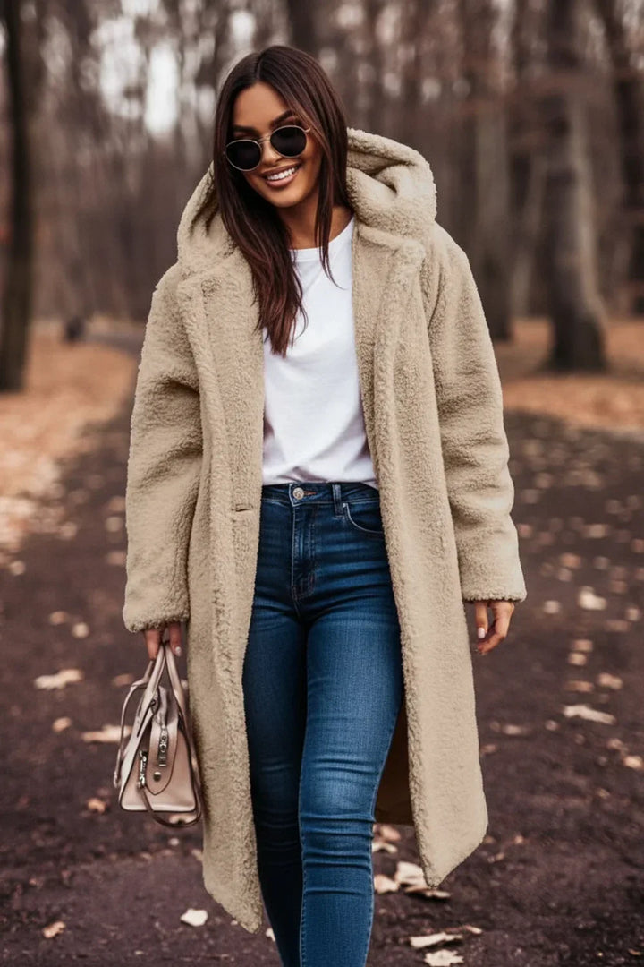 Women's cozy hooded teddy coat, perfect for winter warmth and comfort.
