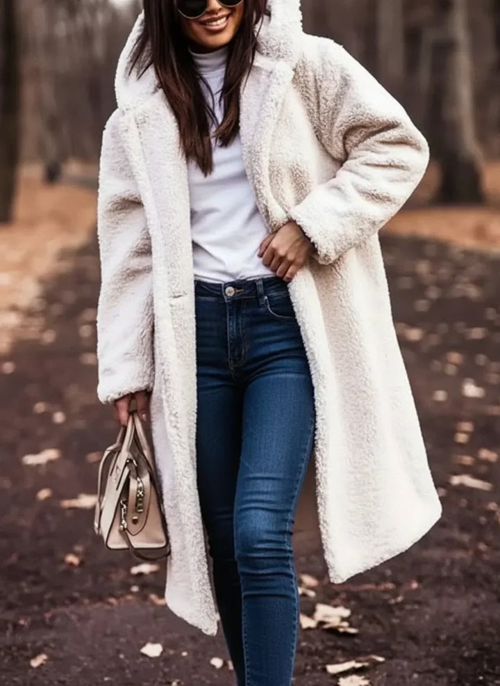 Warm long hooded teddy outerwear, ideal for women's winter fashion.