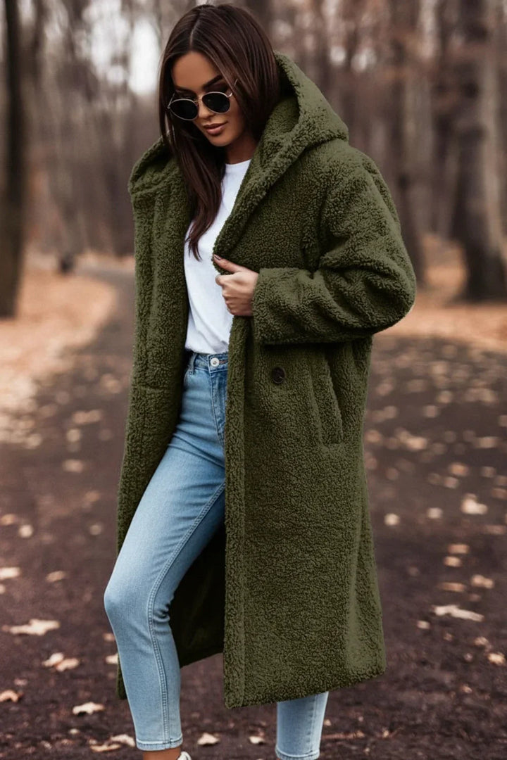 Elegant long hooded teddy coat for women, a comfortable and warm winter fashion statement.