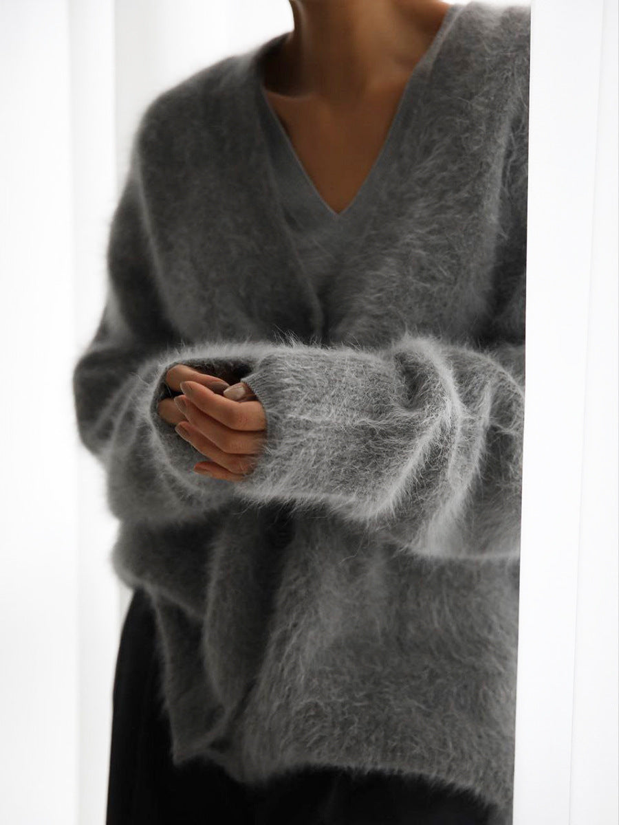 Women's oversized sweater in a neutral cream color, soft and perfect for any outfit