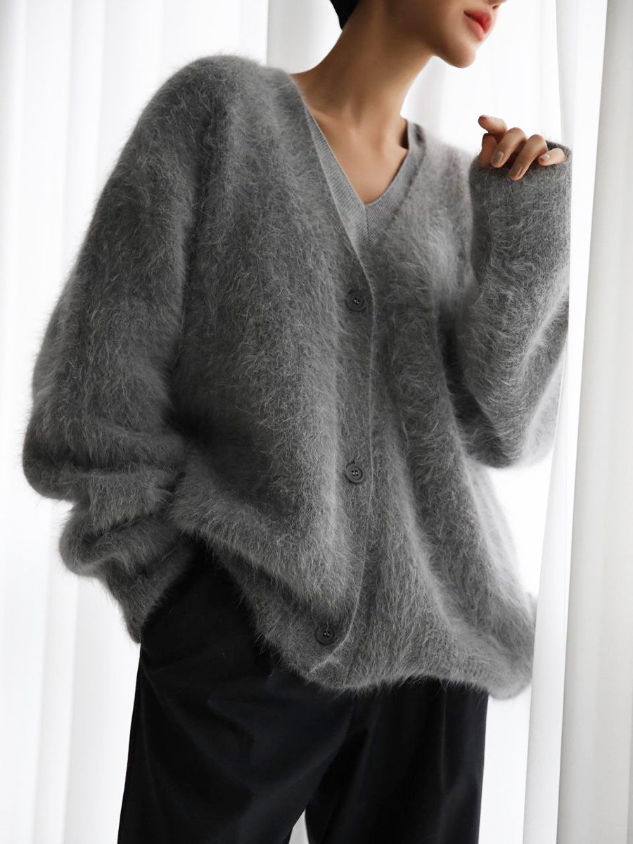 Tag detail on a women's cozy knit oversized cardigan, highlighting 'faux cashmere'
